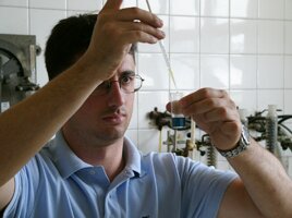 Researcher mixing matierals in a lab